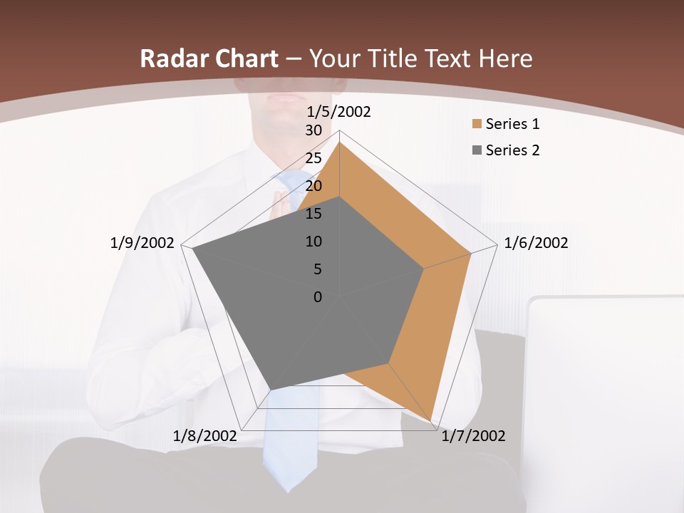 A Man Sitting On A Desk With His Hands Folded In Front Of Him PowerPoint Template