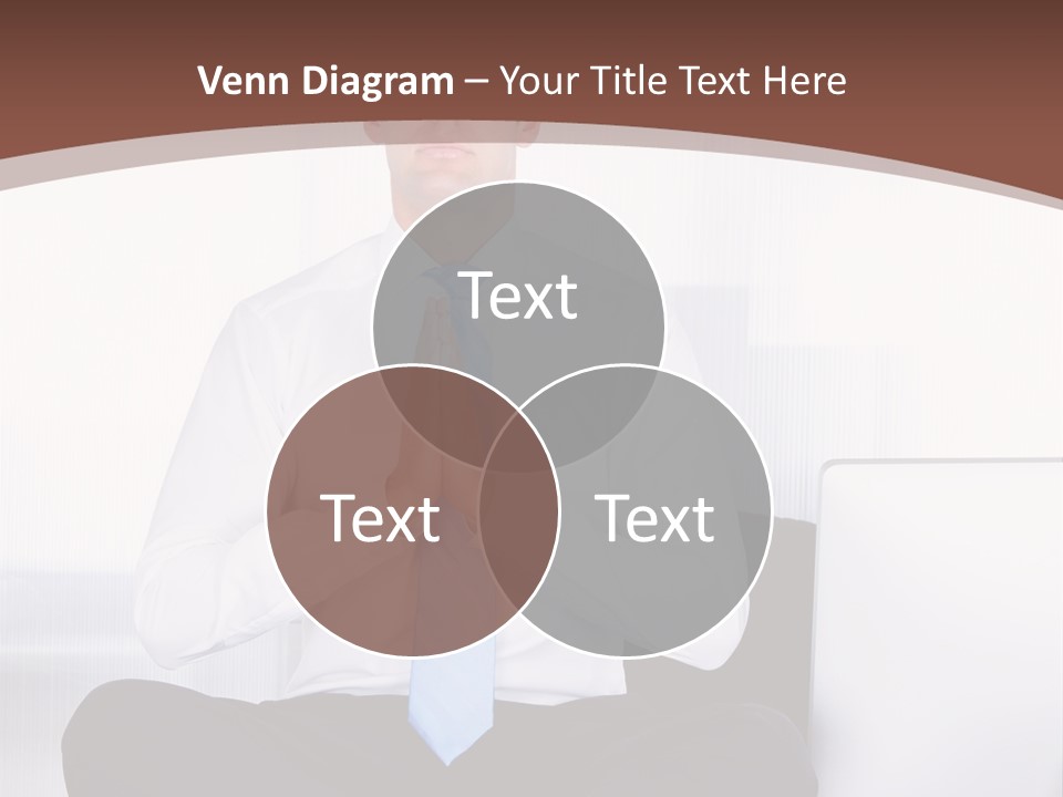 A Man Sitting On A Desk With His Hands Folded In Front Of Him PowerPoint Template