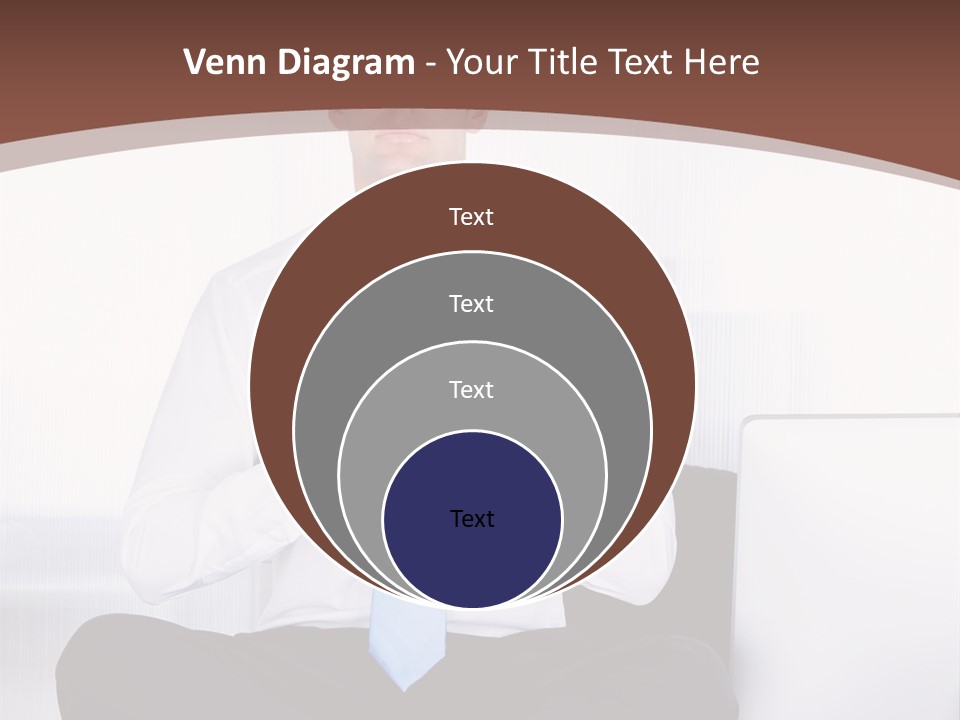 A Man Sitting On A Desk With His Hands Folded In Front Of Him PowerPoint Template