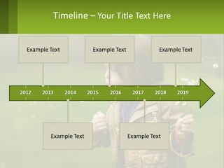 A Little Girl Blowing A Dandelion In A Field PowerPoint Template