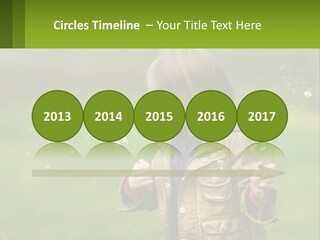 A Little Girl Blowing A Dandelion In A Field PowerPoint Template