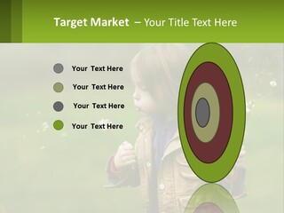 A Little Girl Blowing A Dandelion In A Field PowerPoint Template