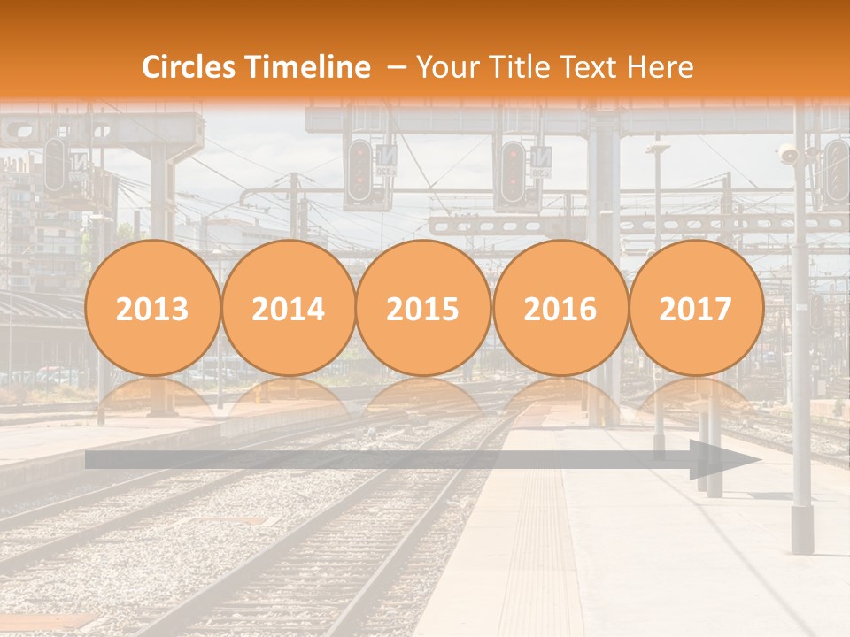 A Train Station With A Train On The Tracks PowerPoint Template