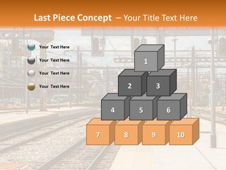 A Train Station With A Train On The Tracks PowerPoint Template