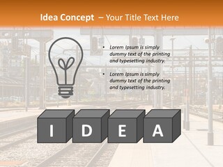 A Train Station With A Train On The Tracks PowerPoint Template