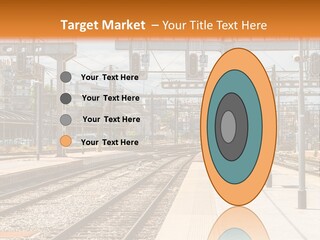 A Train Station With A Train On The Tracks PowerPoint Template