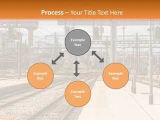 A Train Station With A Train On The Tracks PowerPoint Template