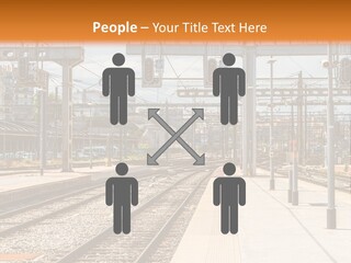 A Train Station With A Train On The Tracks PowerPoint Template