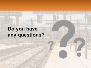 A Train Station With A Train On The Tracks PowerPoint Template