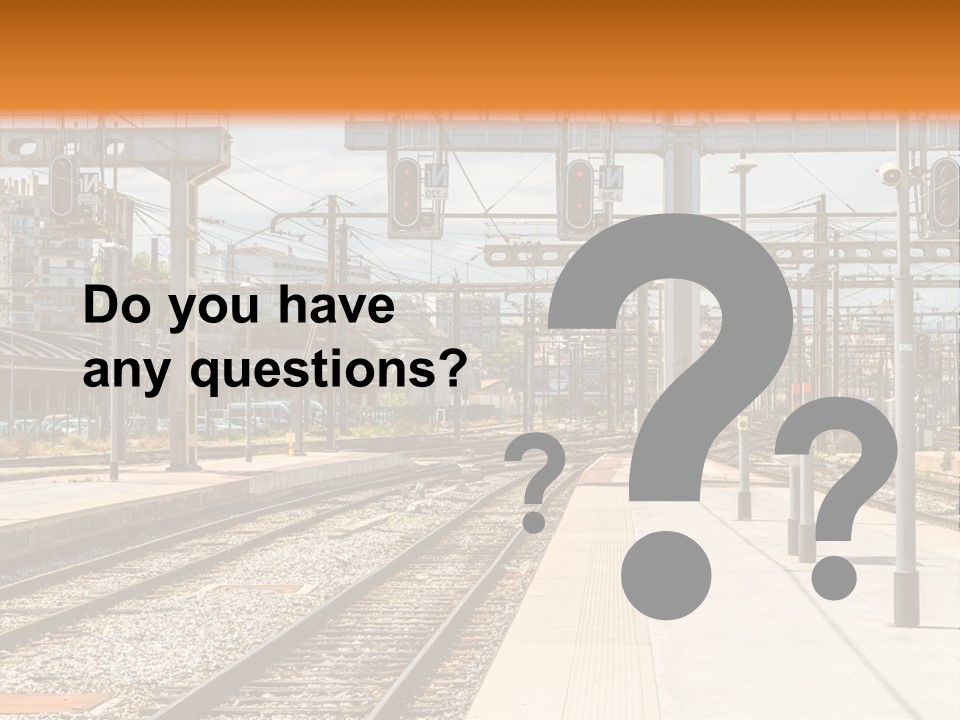 A Train Station With A Train On The Tracks PowerPoint Template