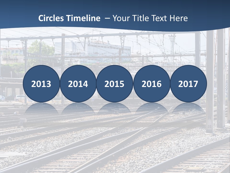 A Blue And White Train Traveling Down Train Tracks PowerPoint Template
