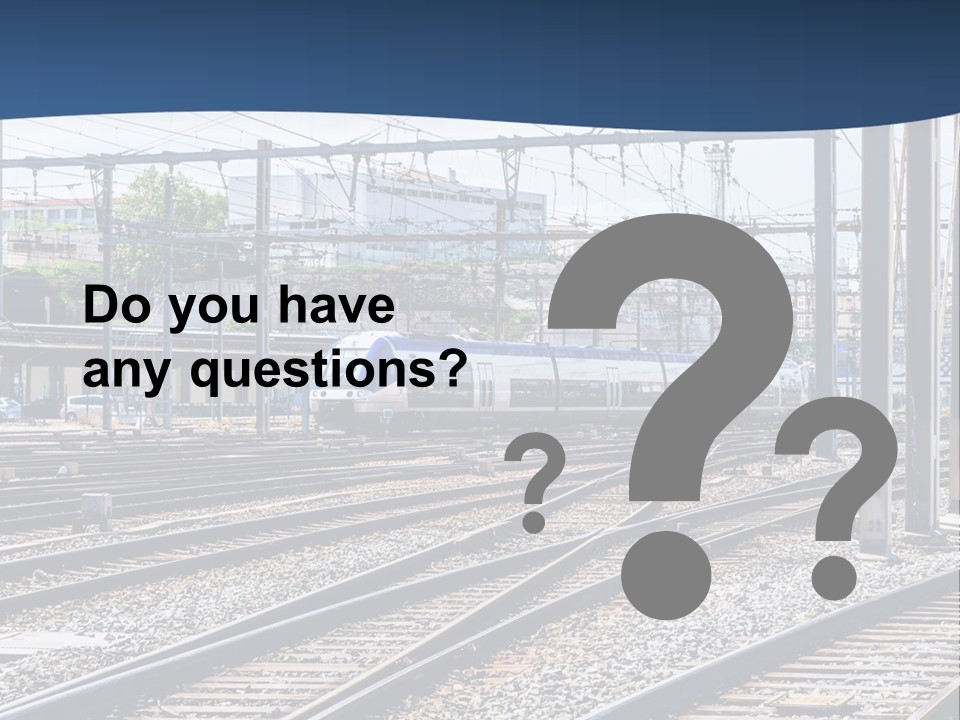 A Blue And White Train Traveling Down Train Tracks PowerPoint Template
