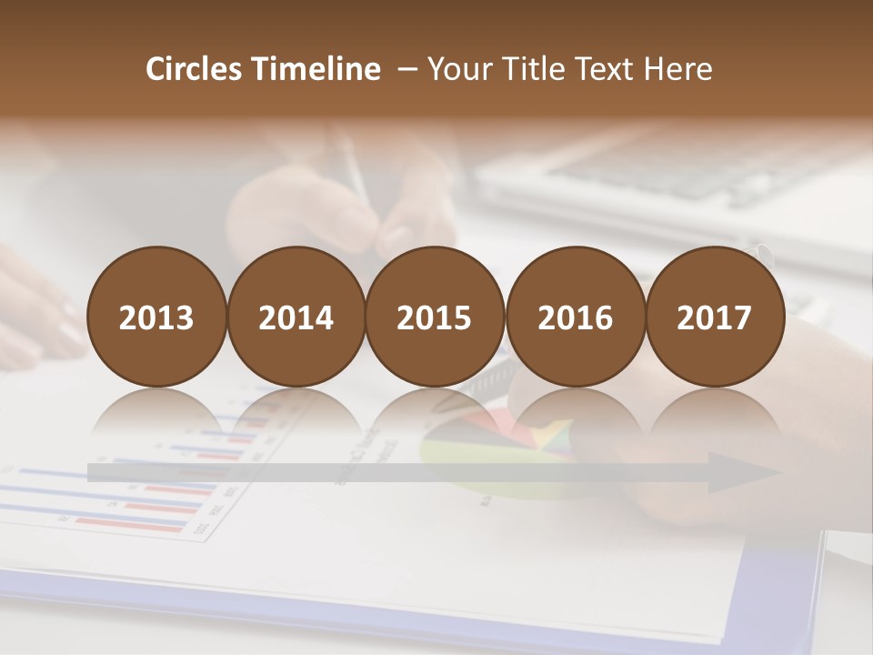 A Group Of People Sitting At A Table With A Laptop And Pen PowerPoint Template