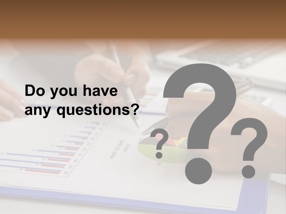 A Group Of People Sitting At A Table With A Laptop And Pen PowerPoint Template