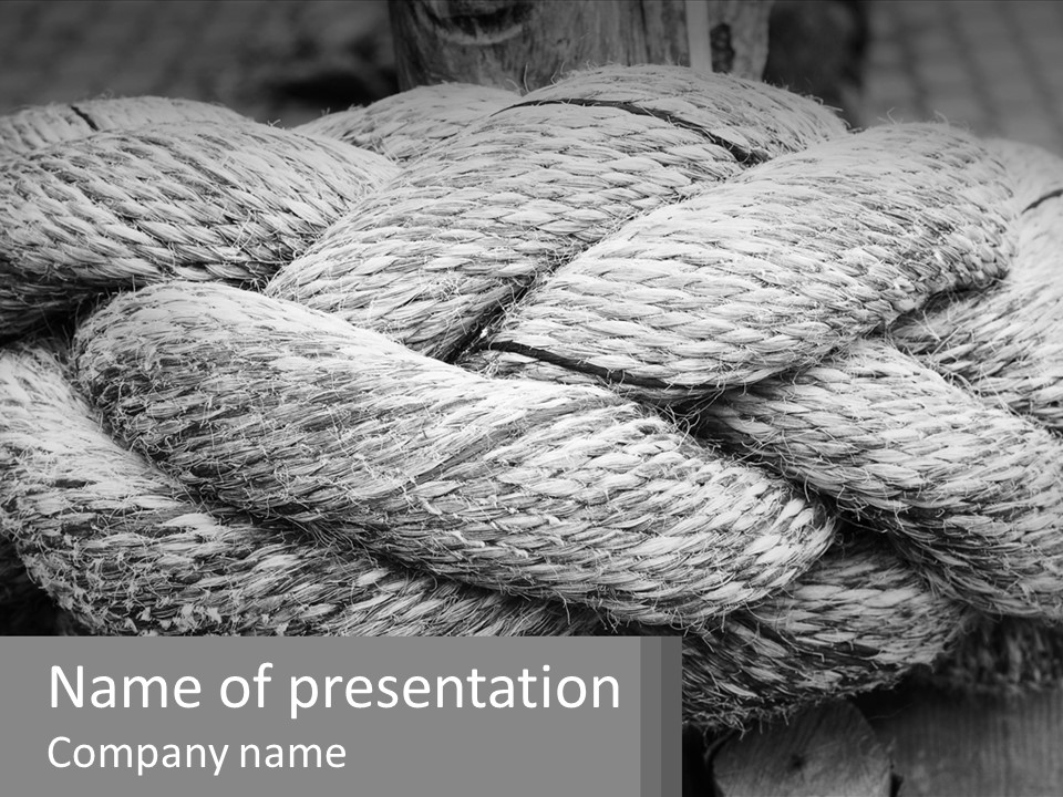 A Rope That Is Tied To A Wooden Post PowerPoint Template