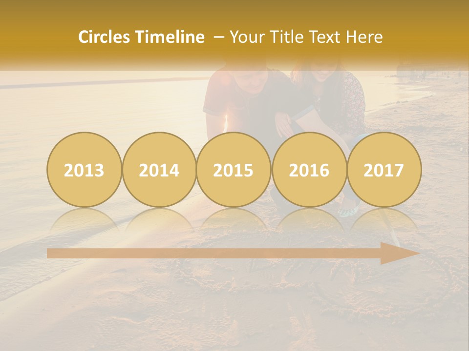 A Man And Woman Kneeling Down On The Beach PowerPoint Template