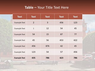 A Large Building With Cars Parked In Front Of It PowerPoint Template