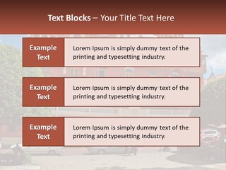 A Large Building With Cars Parked In Front Of It PowerPoint Template