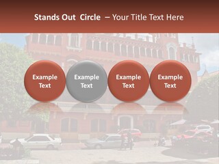 A Large Building With Cars Parked In Front Of It PowerPoint Template