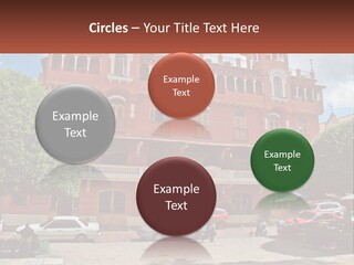 A Large Building With Cars Parked In Front Of It PowerPoint Template