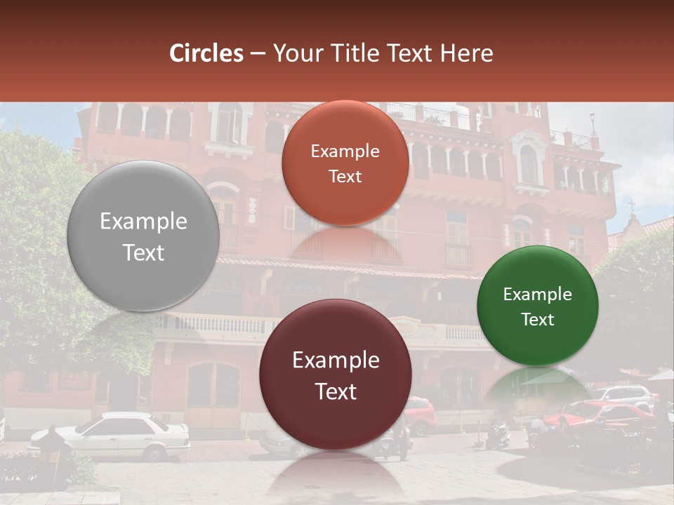 A Large Building With Cars Parked In Front Of It PowerPoint Template