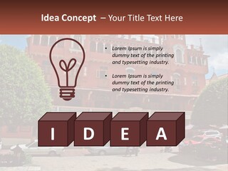 A Large Building With Cars Parked In Front Of It PowerPoint Template