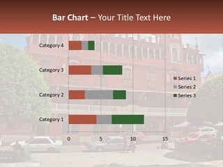 A Large Building With Cars Parked In Front Of It PowerPoint Template