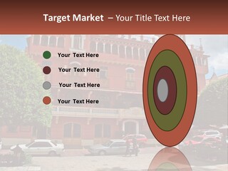 A Large Building With Cars Parked In Front Of It PowerPoint Template