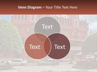 A Large Building With Cars Parked In Front Of It PowerPoint Template