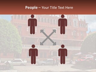 A Large Building With Cars Parked In Front Of It PowerPoint Template