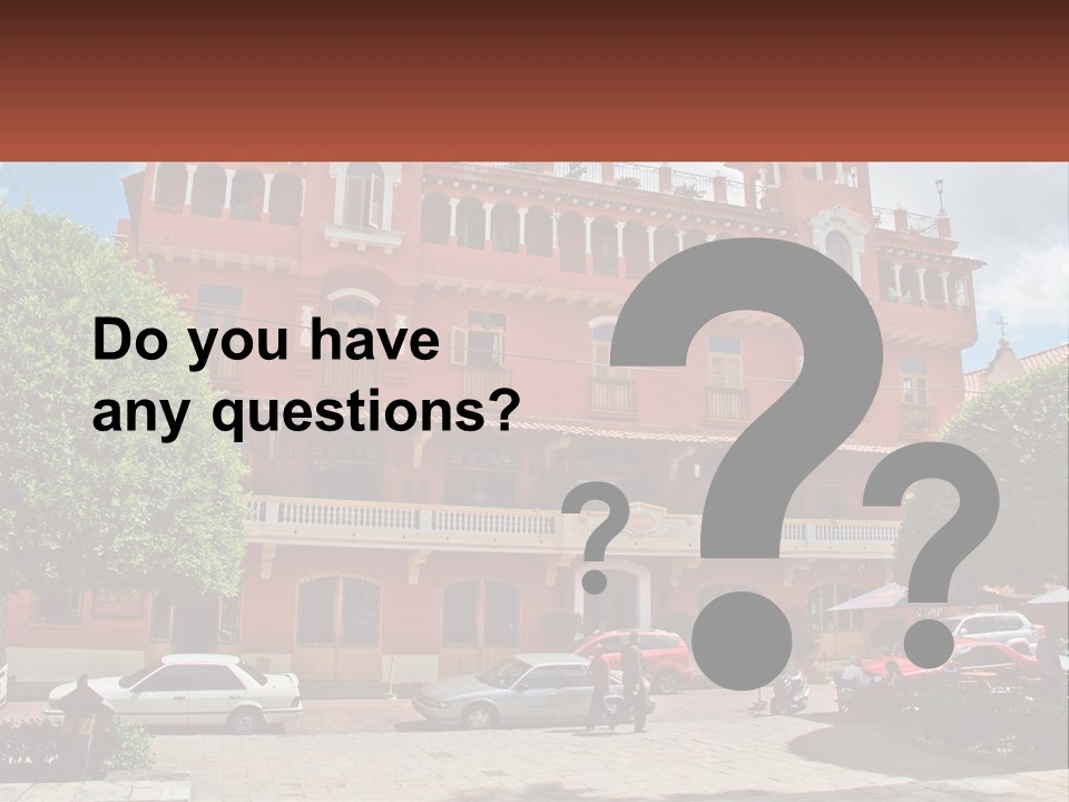 A Large Building With Cars Parked In Front Of It PowerPoint Template