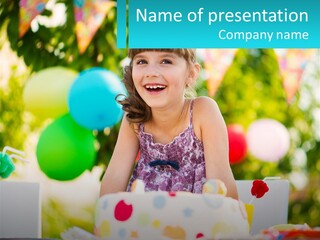 A Little Girl Sitting In Front Of A Birthday Cake PowerPoint Template