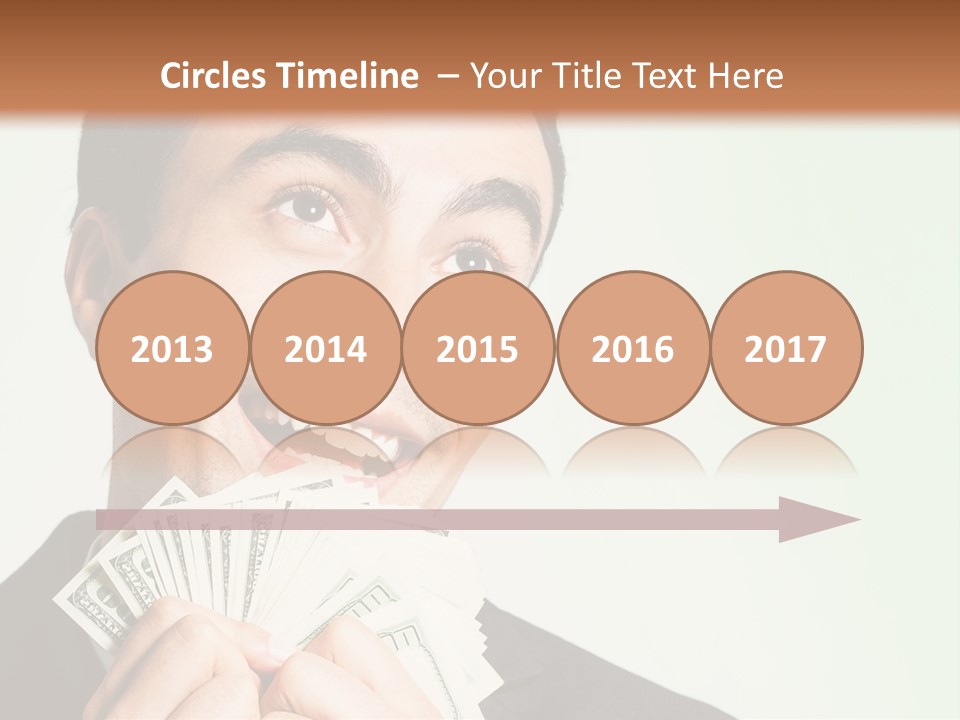 A Man Holding A Bunch Of Money In Front Of His Face PowerPoint Template