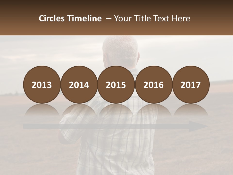 A Man Standing In A Field Looking At The Sky PowerPoint Template