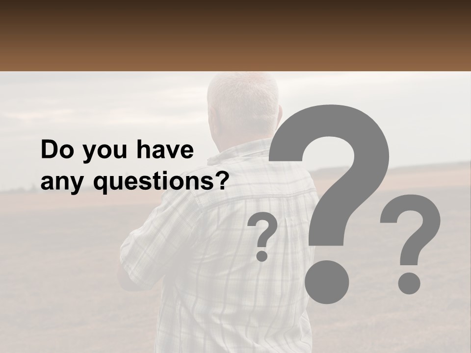 A Man Standing In A Field Looking At The Sky PowerPoint Template