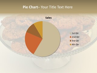 A Glass Plate Filled With Cookies On Top Of A Table PowerPoint Template