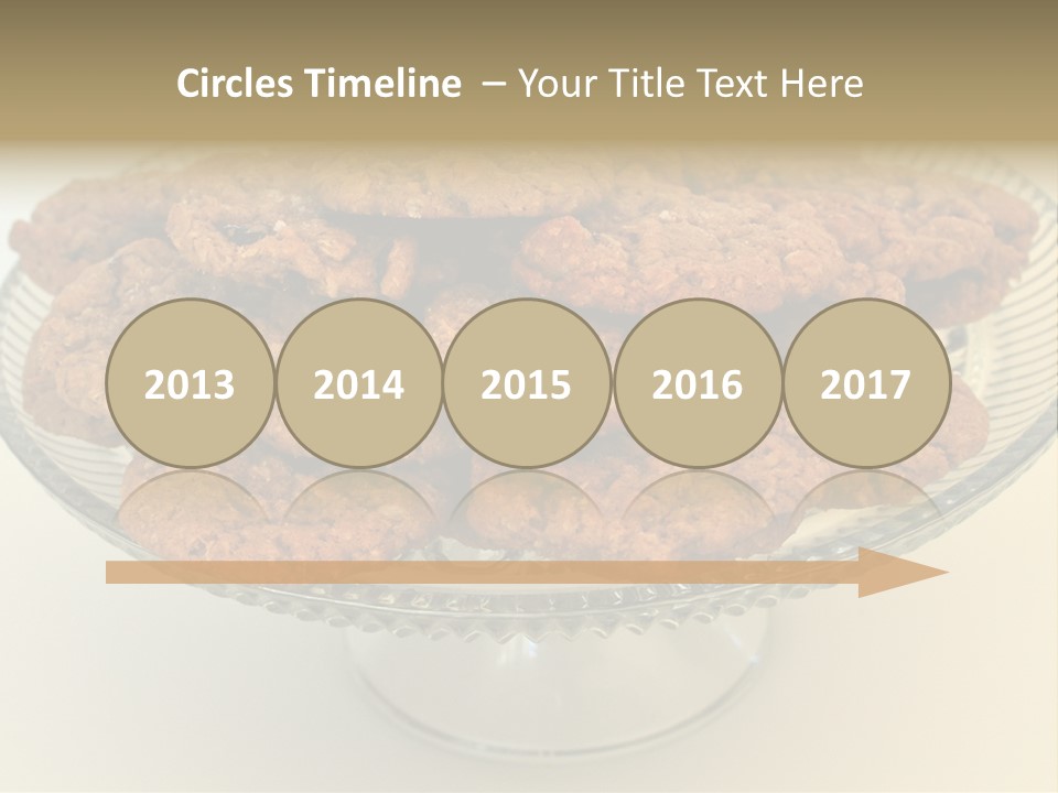 A Glass Plate Filled With Cookies On Top Of A Table PowerPoint Template