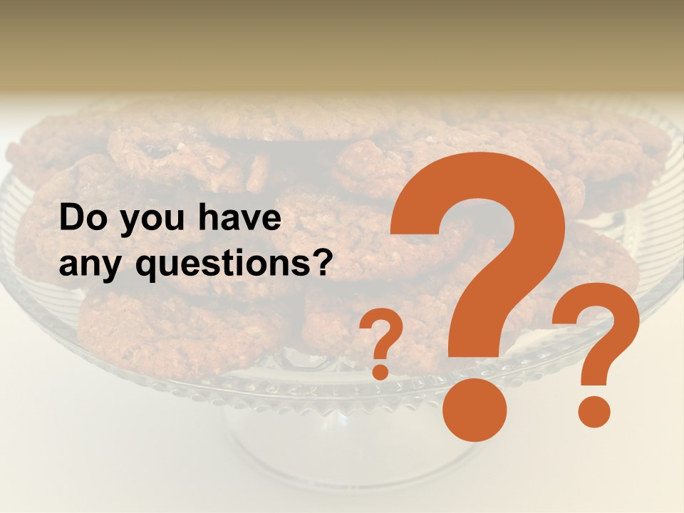 A Glass Plate Filled With Cookies On Top Of A Table PowerPoint Template