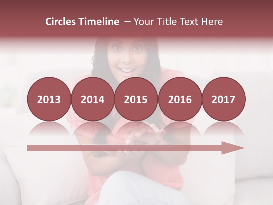 A Woman Sitting On A Couch Holding A Tablet PowerPoint Template