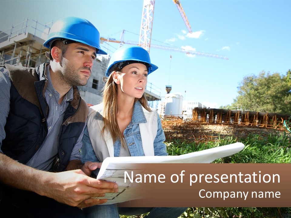 A Man And A Woman In Hardhats Looking At A Blueprint PowerPoint Template
