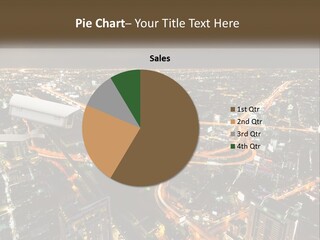 An Aerial View Of A City At Night PowerPoint Template