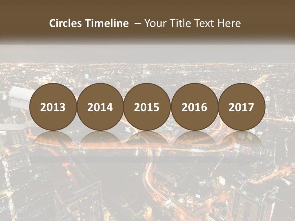 An Aerial View Of A City At Night PowerPoint Template