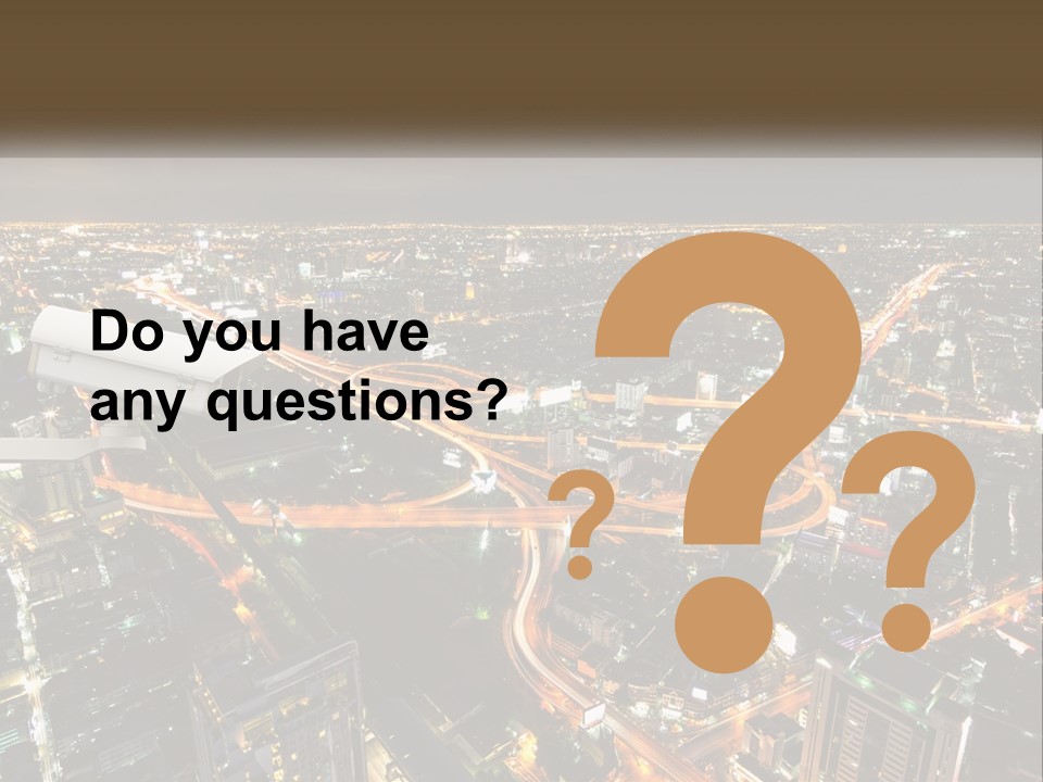 An Aerial View Of A City At Night PowerPoint Template