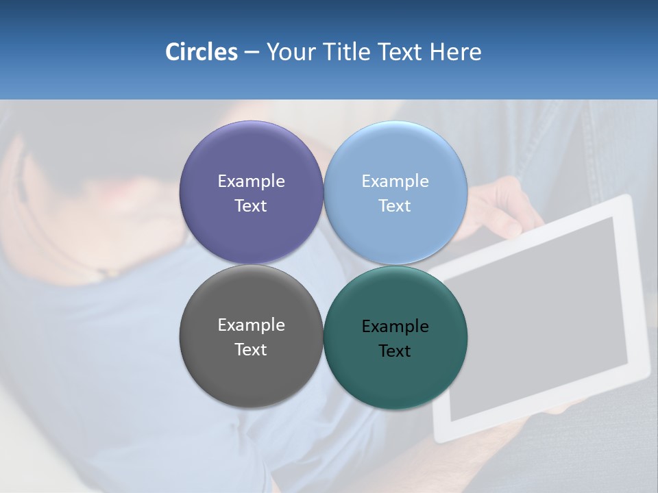 A Man Sitting On A Couch Holding A Tablet PowerPoint Template