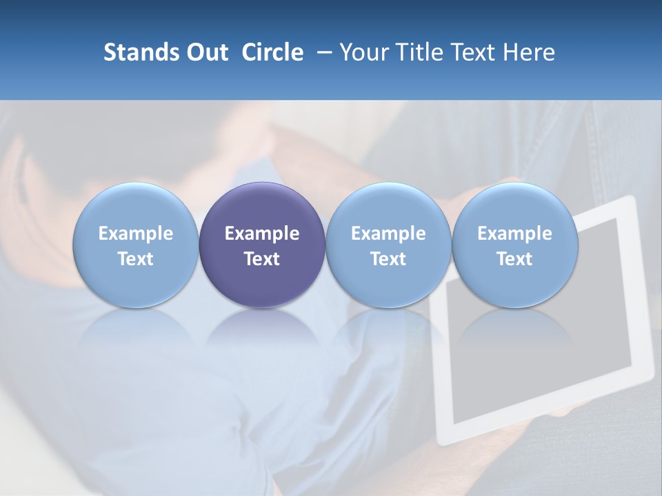 A Man Sitting On A Couch Holding A Tablet PowerPoint Template