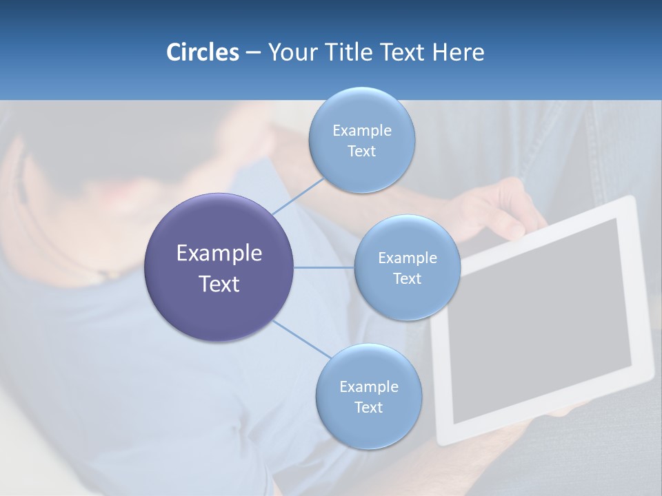 A Man Sitting On A Couch Holding A Tablet PowerPoint Template