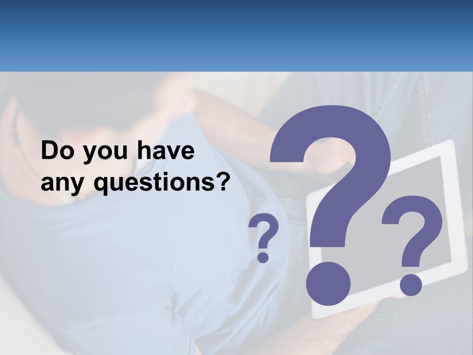 A Man Sitting On A Couch Holding A Tablet PowerPoint Template