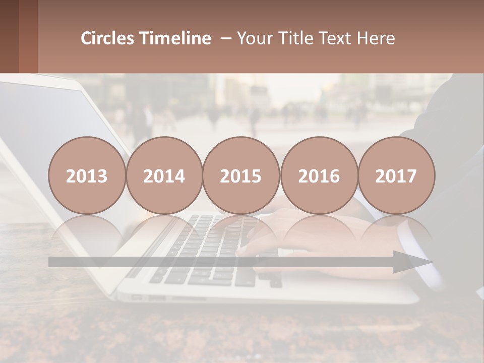 A Person Typing On A Laptop On A Table PowerPoint Template