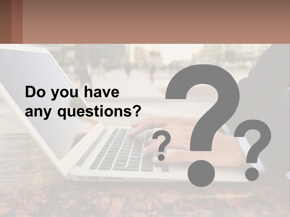 A Person Typing On A Laptop On A Table PowerPoint Template