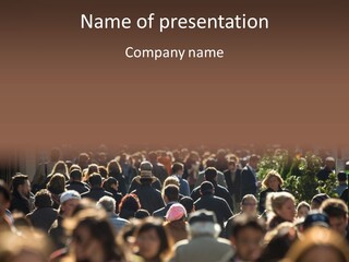A Large Group Of People Walking Down A Street PowerPoint Template